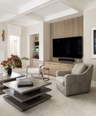 Wood paneling on feature wall behind large wall mounted TV.