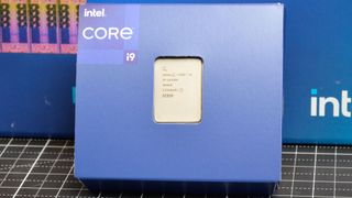 An Intel Core i9-14900K with its promotional packaging