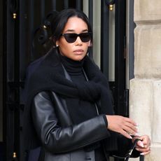 Laura Harrier wearing a black leather jacket in Paris