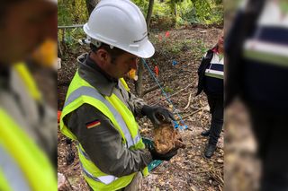 Project leader Colin Welch holds the fuel regulator from the V1, fresh out of the ground after more than 70 years.