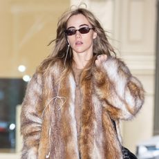 Suki Waterhouse wearing a fur coat in NYC