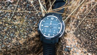 Garmin Instinct Crossover close-up on stones