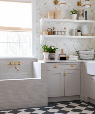 utility room with pet bath and floral wallpaper