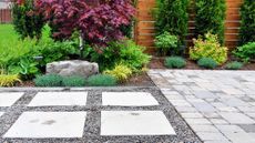 Tidy patio and paving in backyard