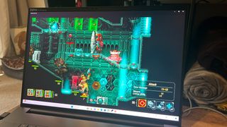 Steamworld Heist running on Razer Blade 18 laptop on a wooden table