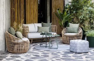 A wicker outdoor furniture set