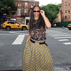 sierra mayhew wearing a plaid skirt in new york city