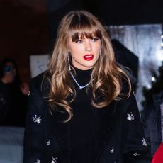 Taylor Swift on her way to dinner wearing diamond drop earrings and loose curls