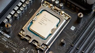 An Intel Core i9-14900K slotted into a motherboard