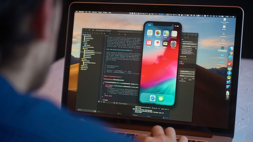 developer launches xcode software and ios simulator program to develop ios app on a MacBook