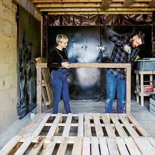 garage with wooden pallets and drill machine