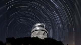 Star trails are seen over the Nicholas U. Mayall 4-meter Telescope on Kitt Peak National Observatory near Tucson, Arizona.