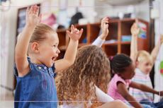 Children in nursery singing nursery rhymes