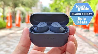 Jabra Elite 8 Active in black held in hand of reviewer