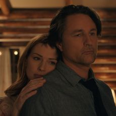 Alexandra Breckenridge as Mel Monroe and Martin Henderson as Jack Sheridan embracing in a cabin like room in virgin river season 6