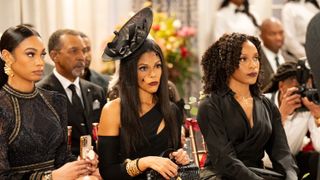 RhonniRose Mantilla as Chelsea Hamilton, Karla Mosely as Danielle Dupree Hamilton and Arielle Prepetit as Naomi Hamilton Hawthorne dressed in black at a wedding in Beyond the Gates