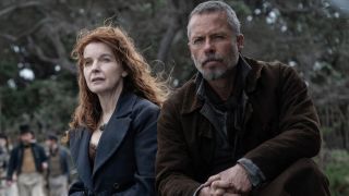 Jacqueline McKenzie and Guy Pearce sit together outside in The Convert.