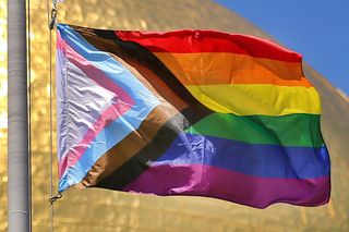 progress pride flag boston, ma june 12 a new transgender flag is hoisted at the mass state house in boston to honor the 50th anniversary of the pride parade on june 12, 2020 the flag represents gay and transgender pride and includes a black and brown stripe to highlight racism the annual pride parade was cancelled this year due to covid 19 photo by john tlumackithe boston globe via getty images