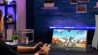 Someone playing a game on a KYY USB-C portable monitor