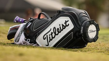 Titleist golf bag lying on the floor