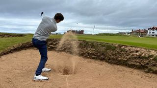 Andrew Wright hitting the Callaway Jaws Raw wedge out a bunker