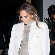 Jennifer Lopez wearing a white coat