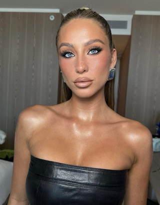 Alix Earle wearing Patrick Ta Beauty Major Glow Balm