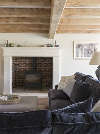 a natural stone fireplace with a brick insert