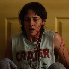 kristen stewart looks shocked covered in blood in the movie love lies bleeding