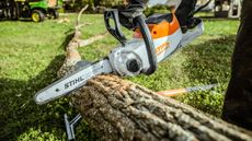 Stihl petrol chainsaw cutting log