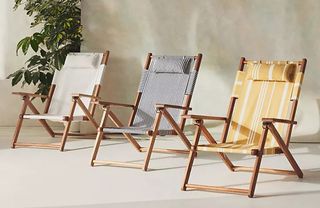 A set of three vintage-look striped deckchairs