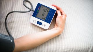 Person measuring blood pressure