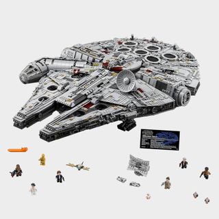 UCS Millennium Falcon with minifigures on a plain background