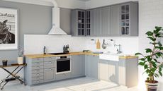 Gray kitchen with white hood and backsplash