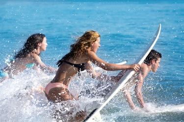 Teenagers surfing