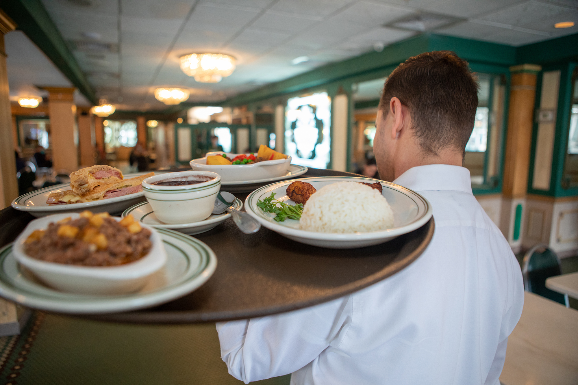 waitress taking food to the table