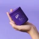 hand holding small kin purple jar