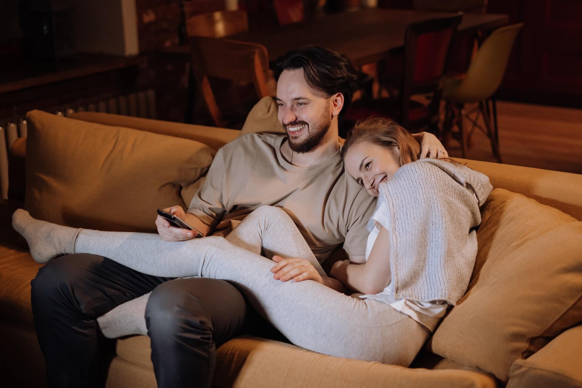 A couple having a relaxing movie night.