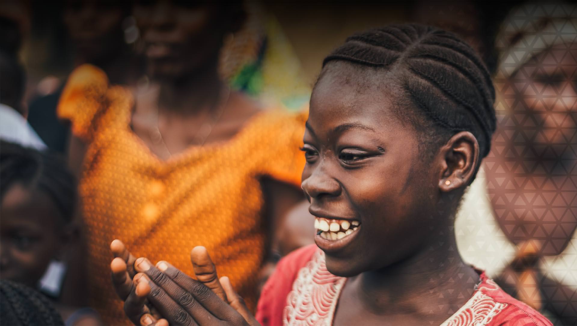 Young woman clapping and smiling