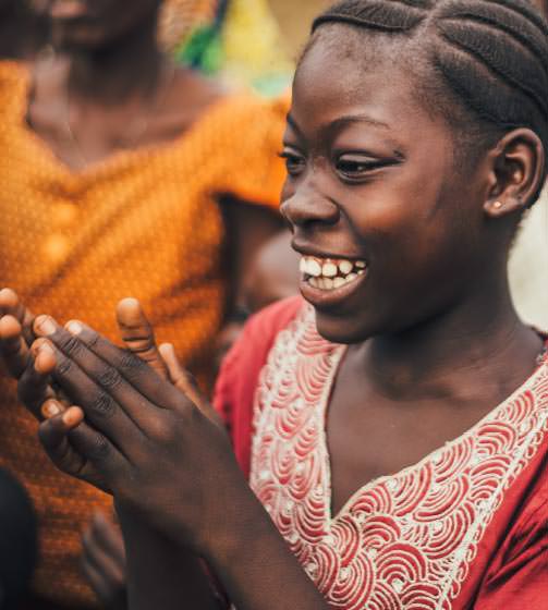 Young woman smiling and clapping