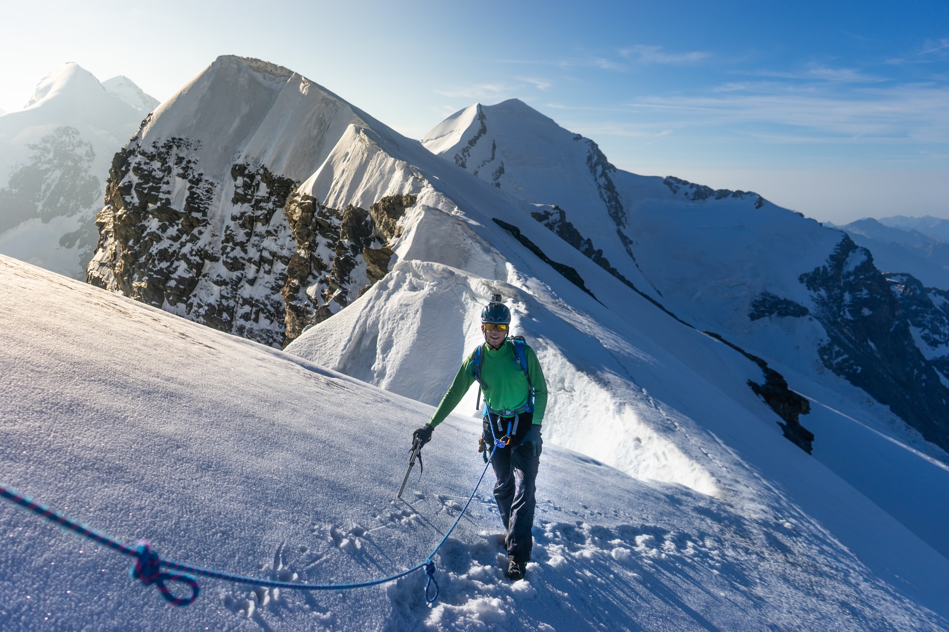 Person mountaineering in snowy mountains