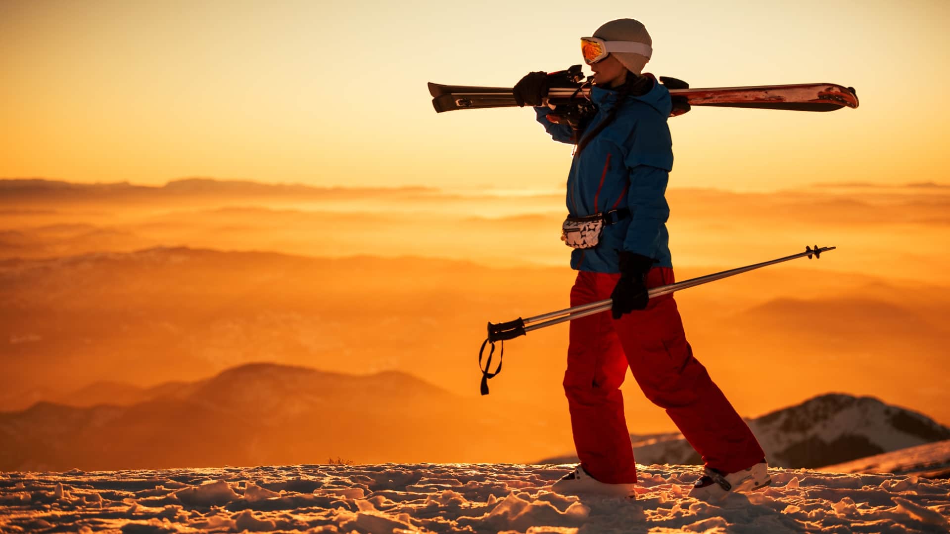 Person carrying cross country skis