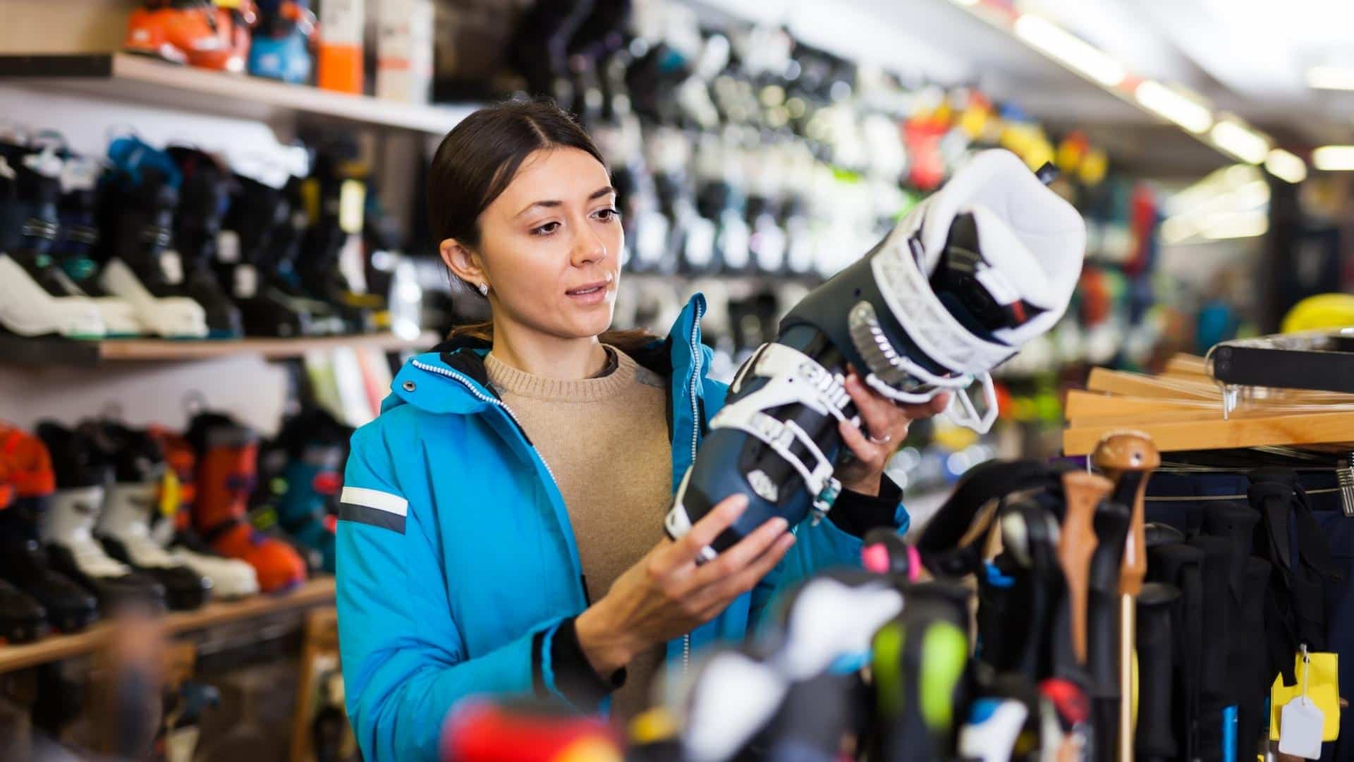 Woman observing a ski boot