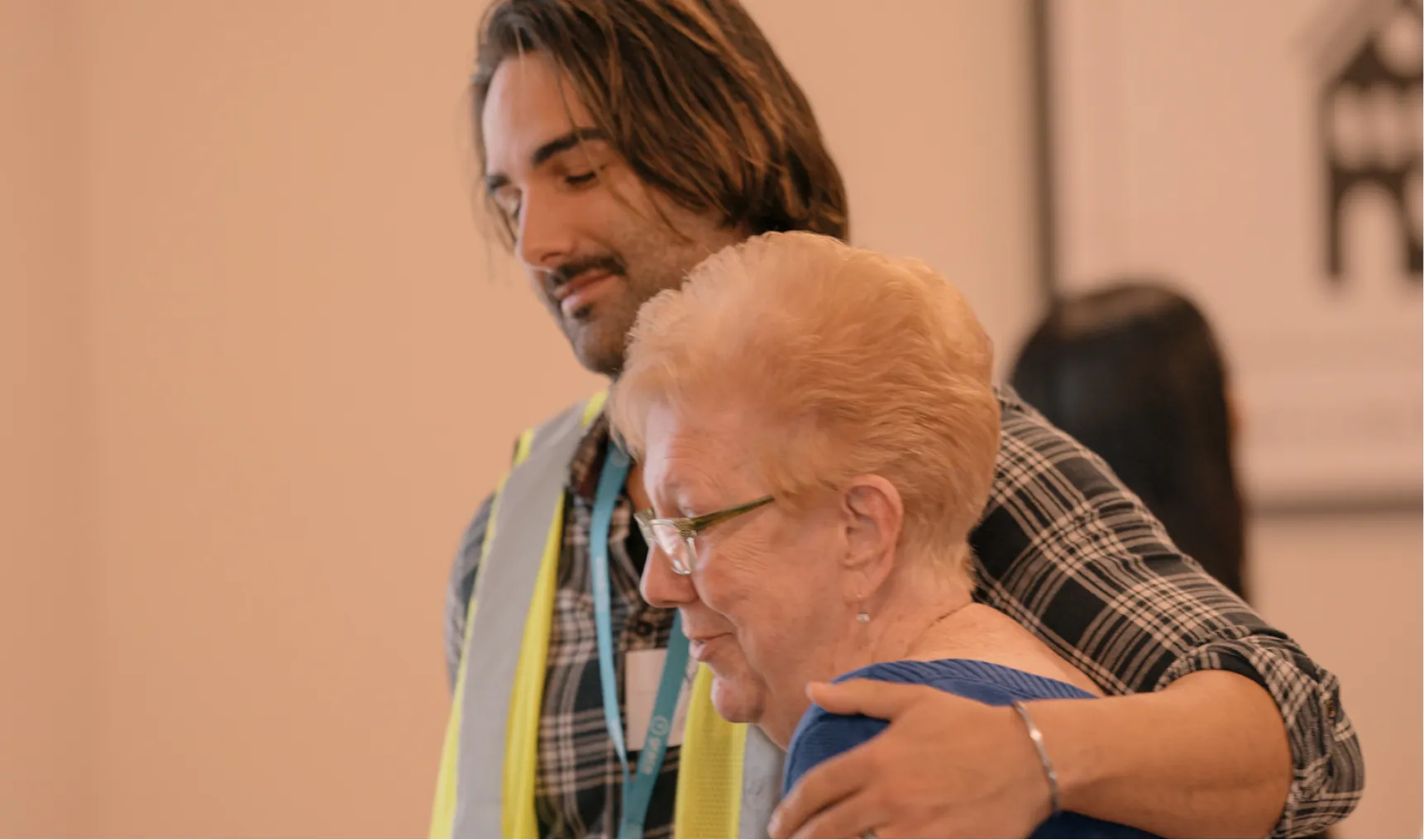 A man helping a church member