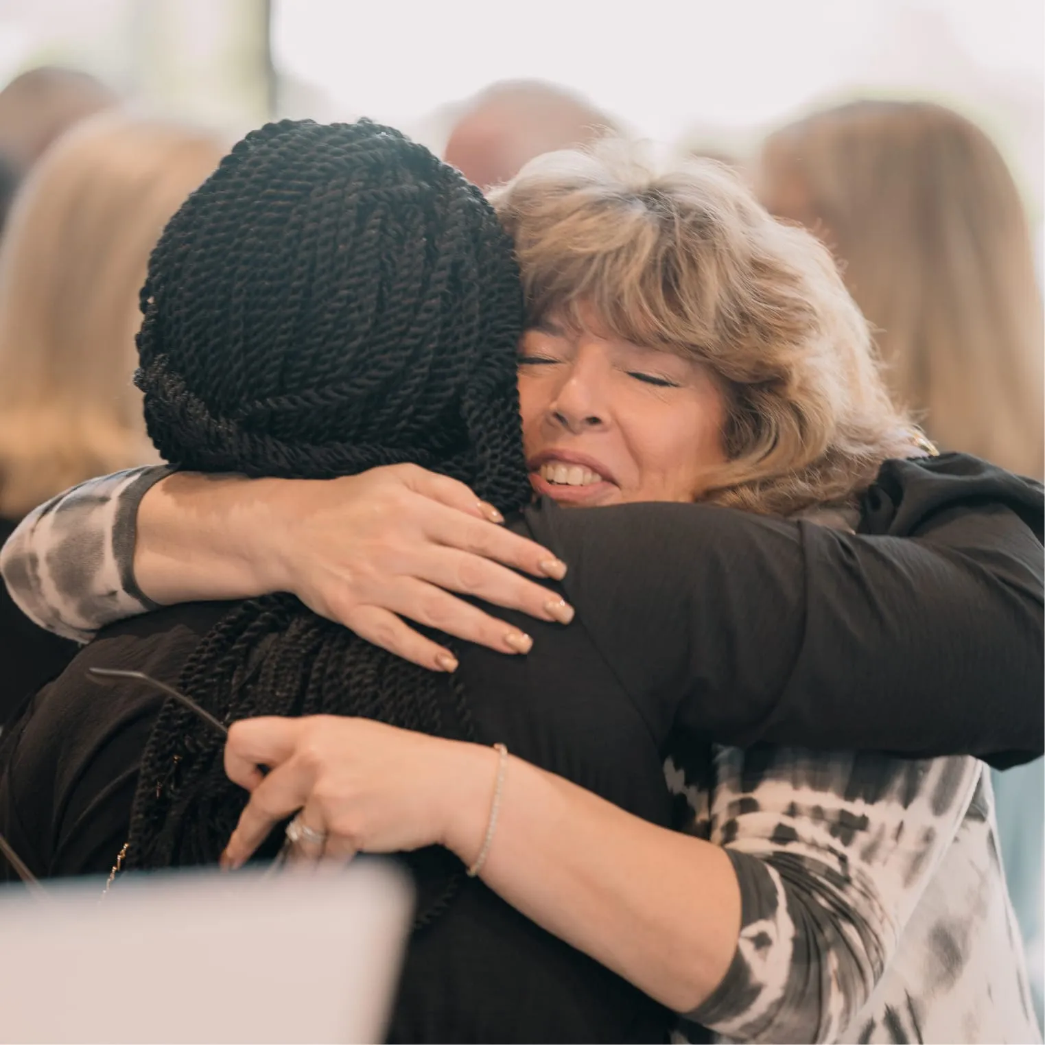 Two women hugging