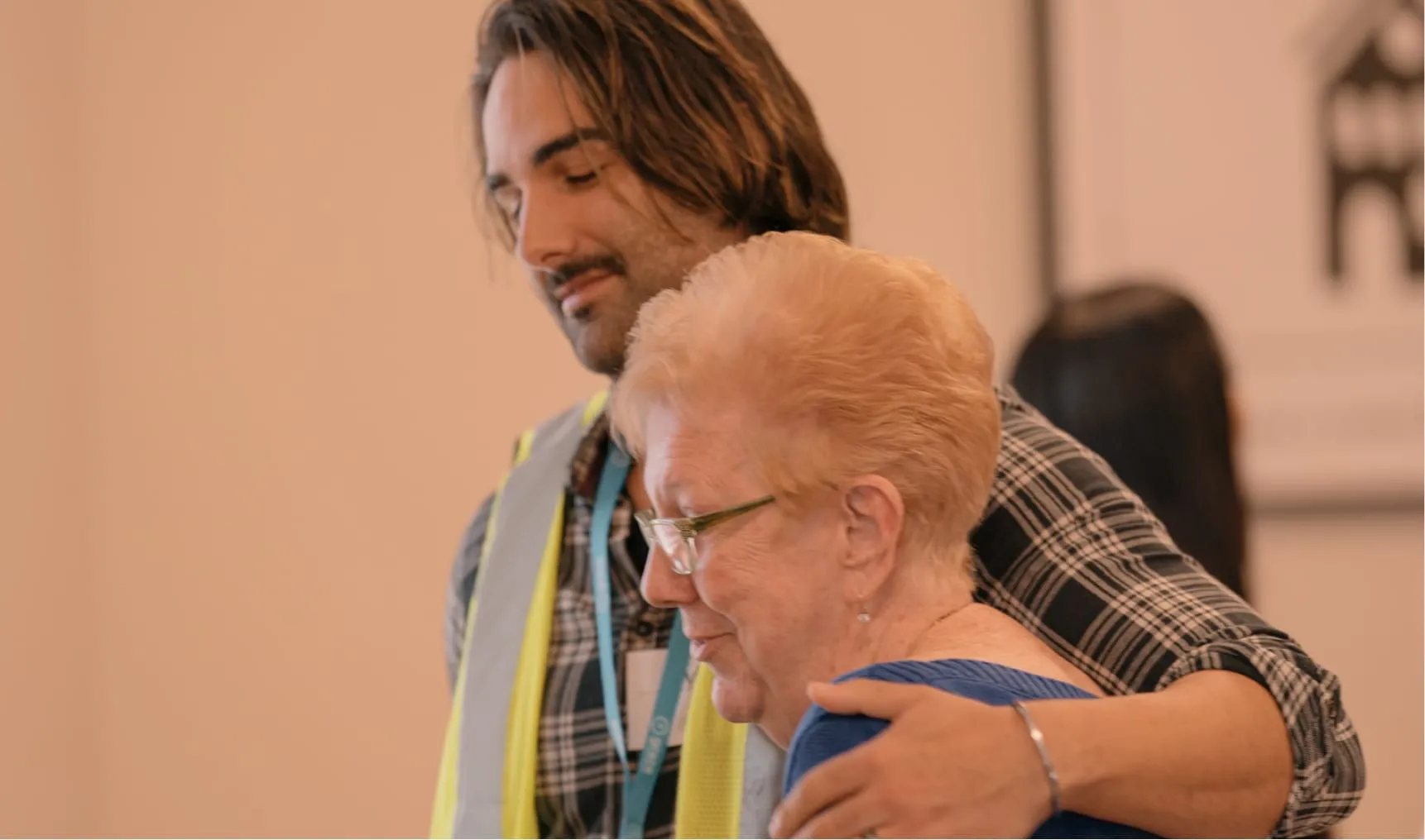 Man hugging older woman