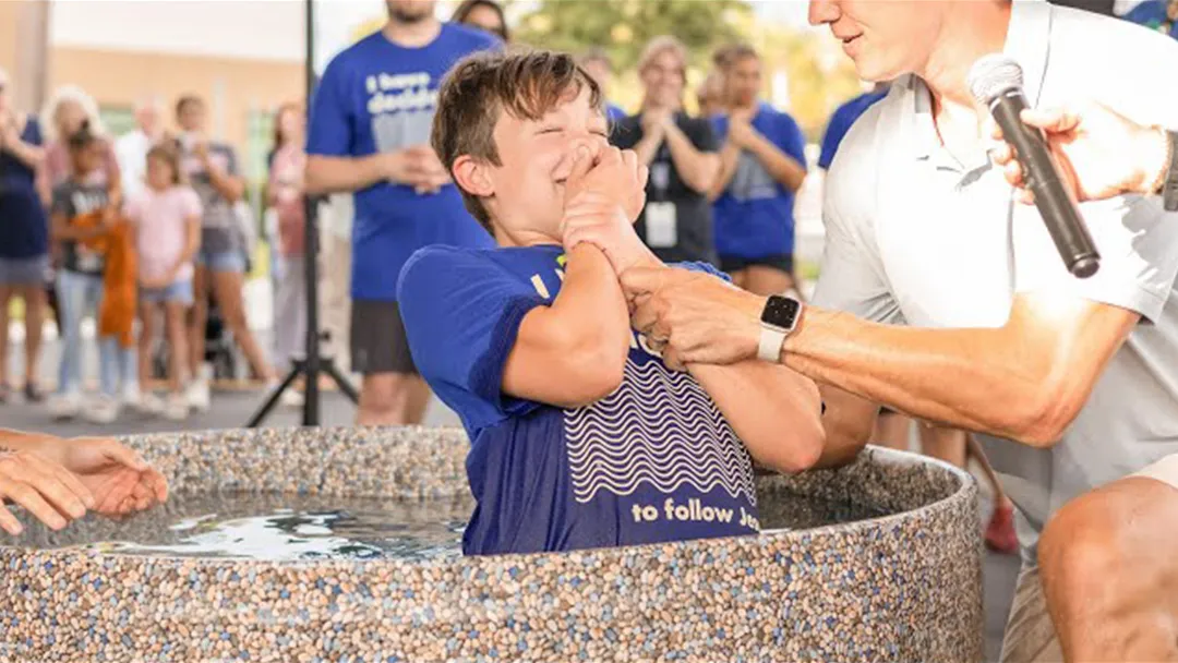 Boy getting baptized