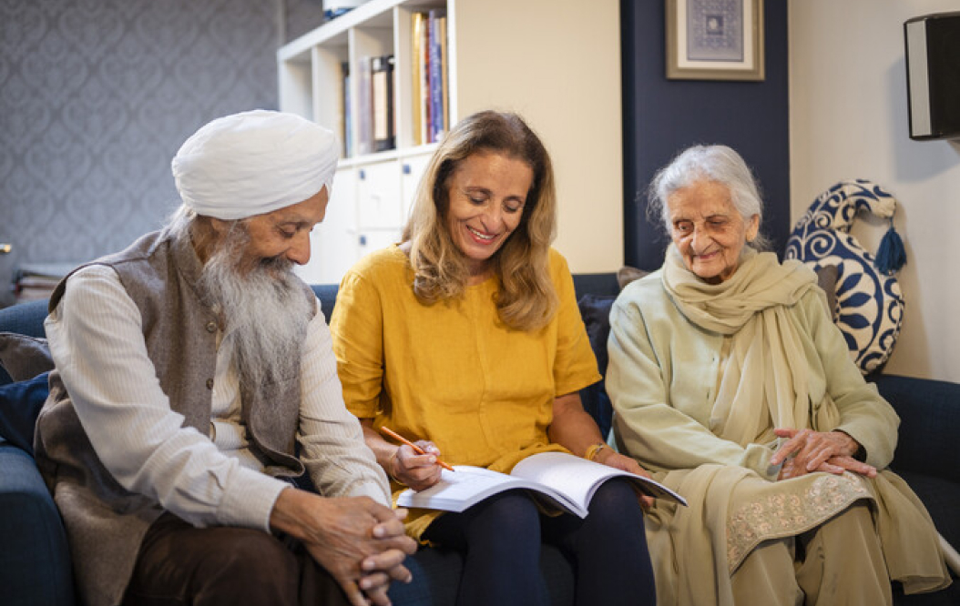 A family reviewing a care assessment