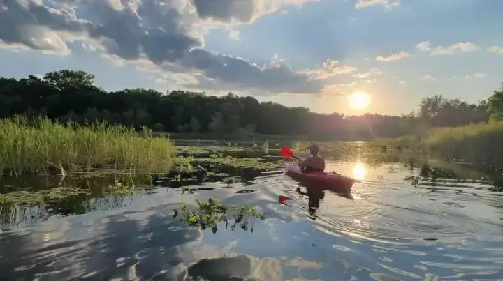 Kayaker enjoying the tranquil waters at Pondhawk Natural Area in Boca Raton, showcasing outdoor activities