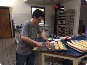 man bakes bread